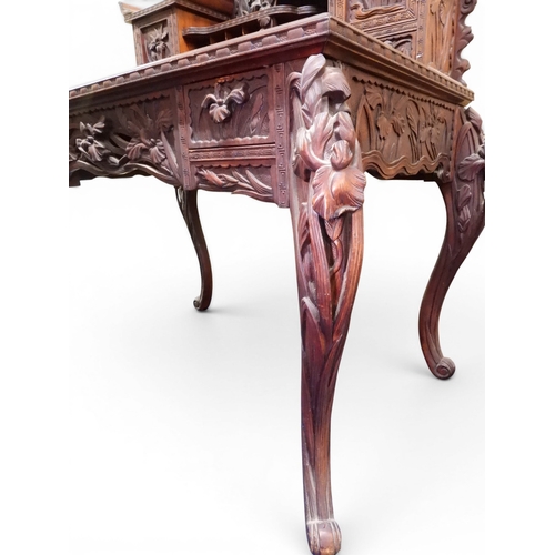2048 - A MEIJI PERIOD JAPANESE HARDWOOD WRITING DESK AND CHAIRwith elaborately floral carved/pierced supers... 