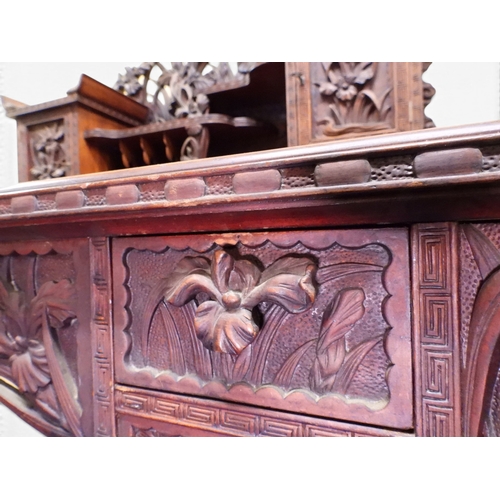 2048 - A MEIJI PERIOD JAPANESE HARDWOOD WRITING DESK AND CHAIRwith elaborately floral carved/pierced supers... 
