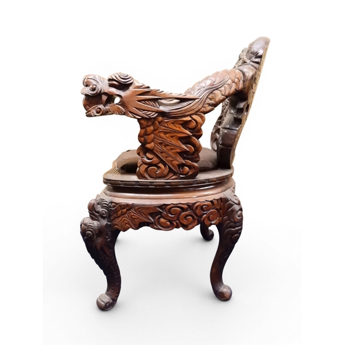 2049 - A MEIJI ERA JAPANESE HARDWOOD TUB ARMCHAIR&nbsp;with elaborately carved/pierced dragon backrest over... 