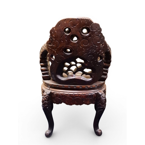 2049 - A MEIJI ERA JAPANESE HARDWOOD TUB ARMCHAIR&nbsp;with elaborately carved/pierced dragon backrest over... 