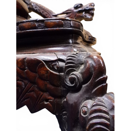 2049 - A MEIJI ERA JAPANESE HARDWOOD TUB ARMCHAIR&nbsp;with elaborately carved/pierced dragon backrest over... 