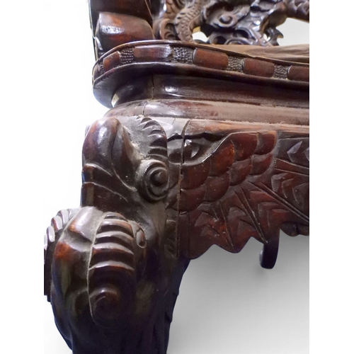 2049 - A MEIJI ERA JAPANESE HARDWOOD TUB ARMCHAIR&nbsp;with elaborately carved/pierced dragon backrest over... 