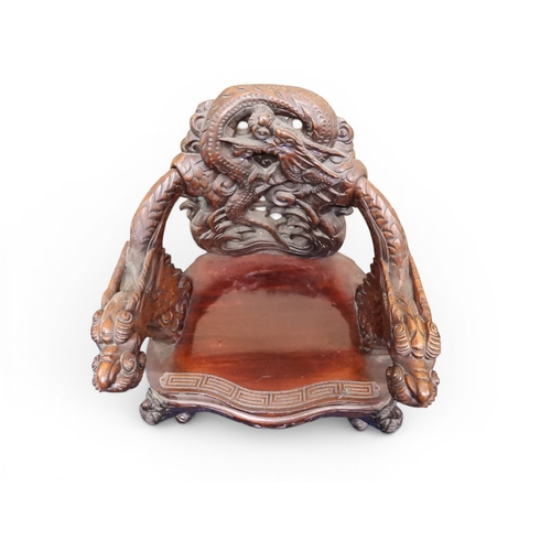 2049 - A MEIJI ERA JAPANESE HARDWOOD TUB ARMCHAIR&nbsp;with elaborately carved/pierced dragon backrest over... 