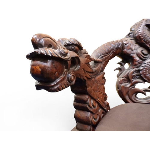 2049 - A MEIJI ERA JAPANESE HARDWOOD TUB ARMCHAIR&nbsp;with elaborately carved/pierced dragon backrest over... 