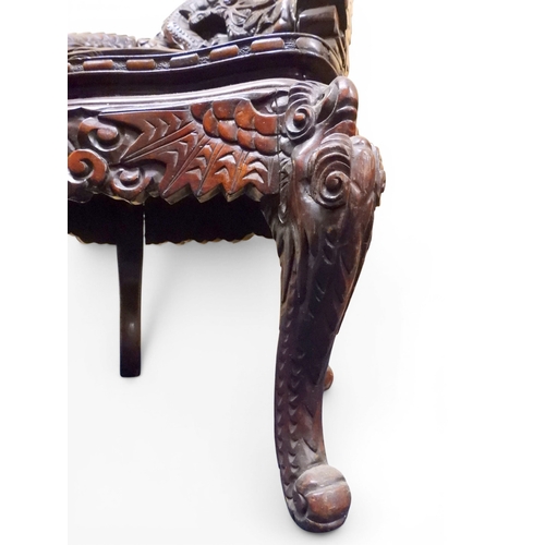 2049 - A MEIJI ERA JAPANESE HARDWOOD TUB ARMCHAIR&nbsp;with elaborately carved/pierced dragon backrest over... 