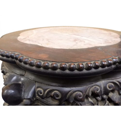 2050 - A 19TH CENTURY CHINESE HARDWOOD JARDINIERE STAND&nbsp;shaped marble inset top over carved pierced fr... 
