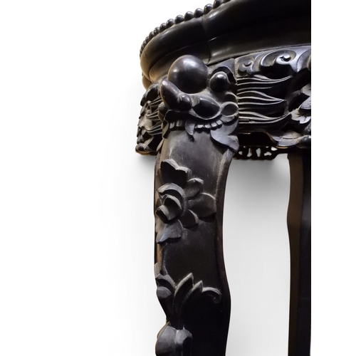 2050 - A 19TH CENTURY CHINESE HARDWOOD JARDINIERE STAND&nbsp;shaped marble inset top over carved pierced fr... 