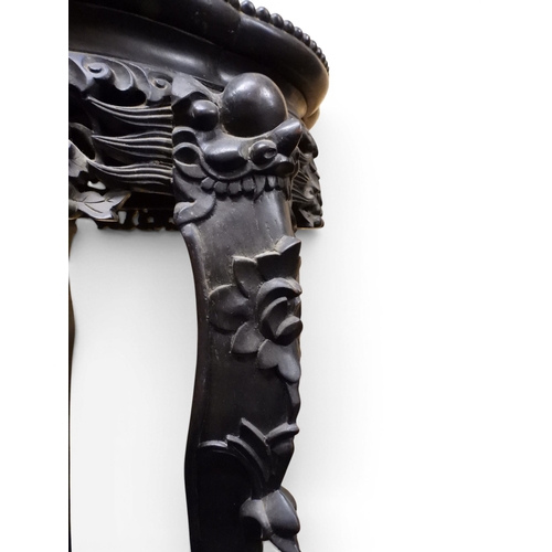 2050 - A 19TH CENTURY CHINESE HARDWOOD JARDINIERE STAND&nbsp;shaped marble inset top over carved pierced fr... 