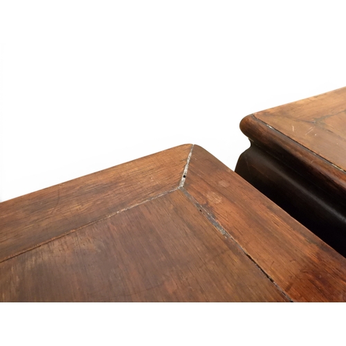 2052 - A PAIR OF 19TH CENTURY CHINESE HARDWOOD LOW TABLES with plain rectangular tops on square shaped supp... 