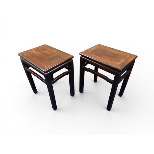 2052 - A PAIR OF 19TH CENTURY CHINESE HARDWOOD LOW TABLES with plain rectangular tops on square shaped supp... 
