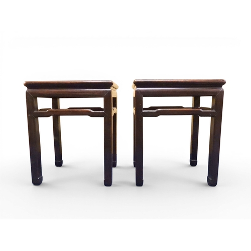 2052 - A PAIR OF 19TH CENTURY CHINESE HARDWOOD LOW TABLES with plain rectangular tops on square shaped supp... 