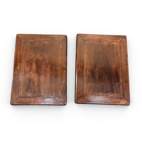 2052 - A PAIR OF 19TH CENTURY CHINESE HARDWOOD LOW TABLES with plain rectangular tops on square shaped supp... 