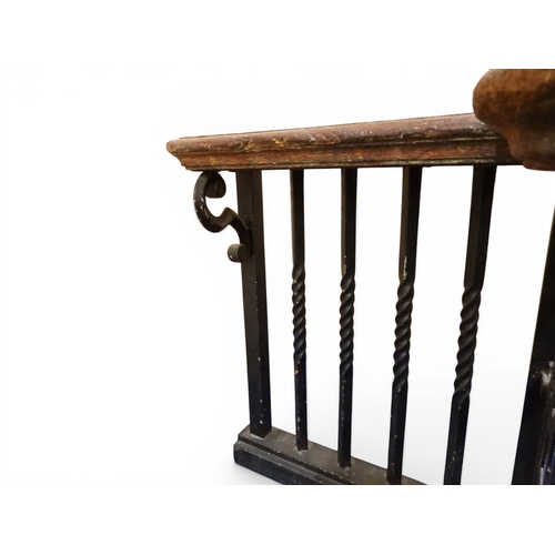 2056 - A LARGE 19TH CENTURY WROUGHT IRON CLUB FENDERwith oak topped seats to corners over twisted square ra... 
