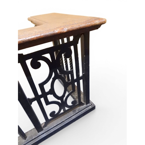 2056 - A LARGE 19TH CENTURY WROUGHT IRON CLUB FENDERwith oak topped seats to corners over twisted square ra... 