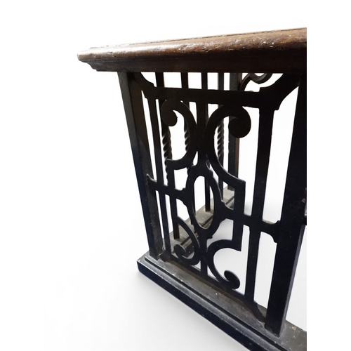 2056 - A LARGE 19TH CENTURY WROUGHT IRON CLUB FENDERwith oak topped seats to corners over twisted square ra... 