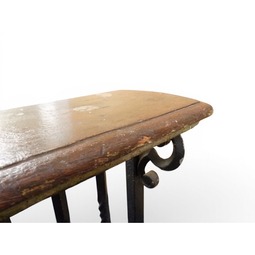 2056 - A LARGE 19TH CENTURY WROUGHT IRON CLUB FENDERwith oak topped seats to corners over twisted square ra... 