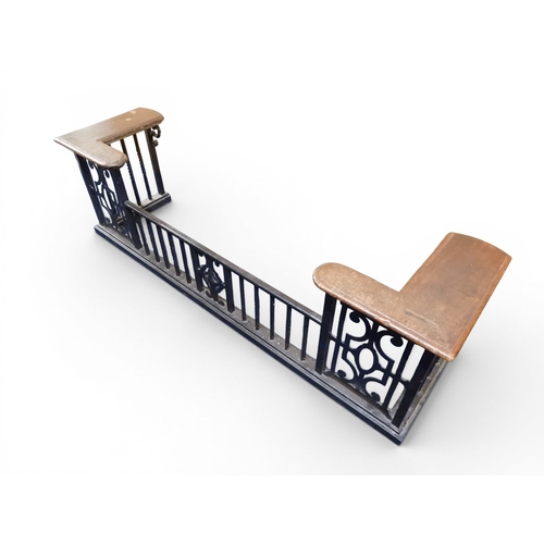 2056 - A LARGE 19TH CENTURY WROUGHT IRON CLUB FENDERwith oak topped seats to corners over twisted square ra... 