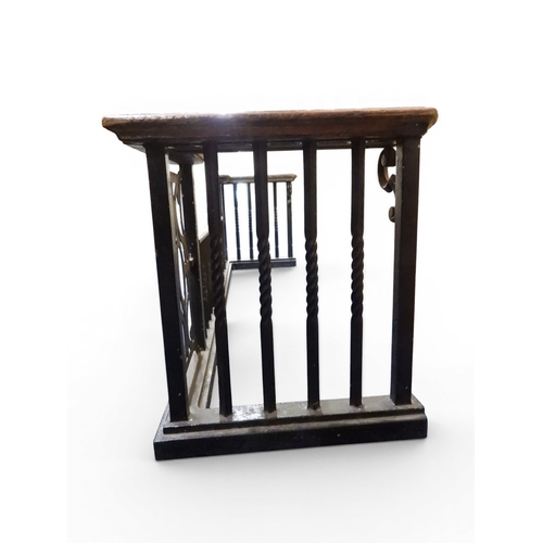 2056 - A LARGE 19TH CENTURY WROUGHT IRON CLUB FENDERwith oak topped seats to corners over twisted square ra... 