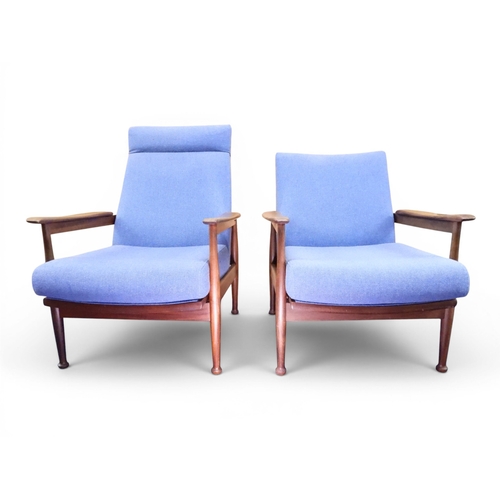 A HIS AND HER PAIR OF MID 20TH CENTURY TEAK FRAMED GUY RODGERS "MANHATTAN" RECLINING ARMCHAIRS
