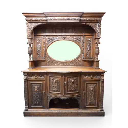 2028 - A LARGE LATE 19TH CENTURY CONTINENTAL OAK MIRROR BACK SIDEBOARDwith moulded projecting cornice on ca... 