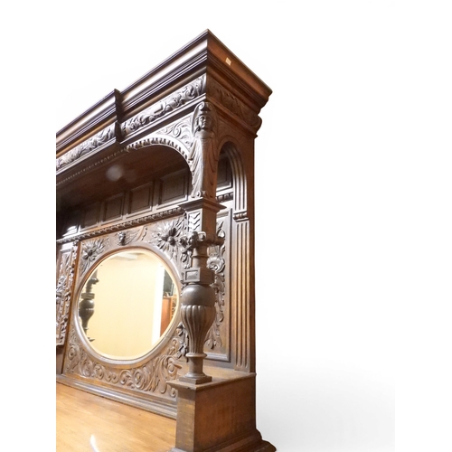 2028 - A LARGE LATE 19TH CENTURY CONTINENTAL OAK MIRROR BACK SIDEBOARDwith moulded projecting cornice on ca... 