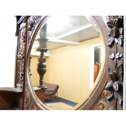 2028 - A LARGE LATE 19TH CENTURY CONTINENTAL OAK MIRROR BACK SIDEBOARDwith moulded projecting cornice on ca... 