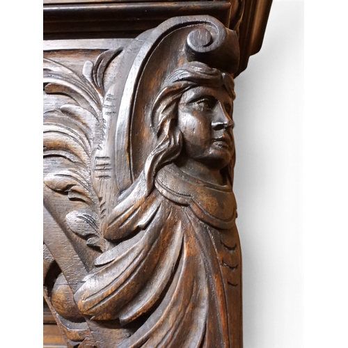 2028 - A LARGE LATE 19TH CENTURY CONTINENTAL OAK MIRROR BACK SIDEBOARDwith moulded projecting cornice on ca... 