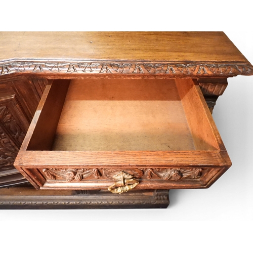 2028 - A LARGE LATE 19TH CENTURY CONTINENTAL OAK MIRROR BACK SIDEBOARDwith moulded projecting cornice on ca... 