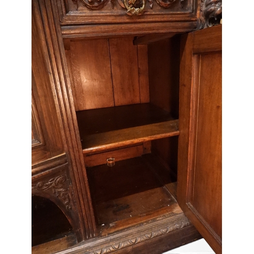 2028 - A LARGE LATE 19TH CENTURY CONTINENTAL OAK MIRROR BACK SIDEBOARDwith moulded projecting cornice on ca... 