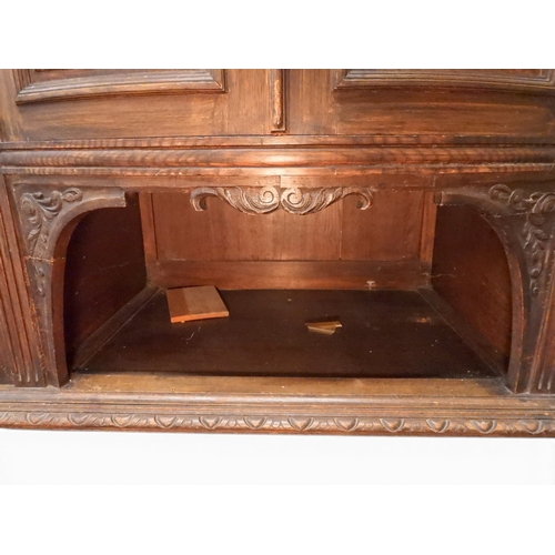 2028 - A LARGE LATE 19TH CENTURY CONTINENTAL OAK MIRROR BACK SIDEBOARDwith moulded projecting cornice on ca... 