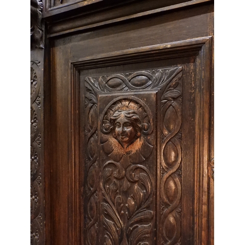 2028 - A LARGE LATE 19TH CENTURY CONTINENTAL OAK MIRROR BACK SIDEBOARDwith moulded projecting cornice on ca... 
