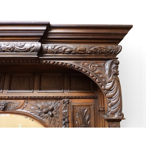 2028 - A LARGE LATE 19TH CENTURY CONTINENTAL OAK MIRROR BACK SIDEBOARDwith moulded projecting cornice on ca... 