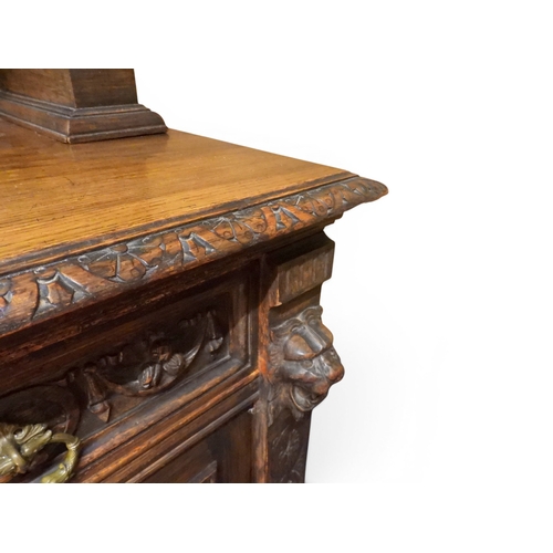 2028 - A LARGE LATE 19TH CENTURY CONTINENTAL OAK MIRROR BACK SIDEBOARDwith moulded projecting cornice on ca... 
