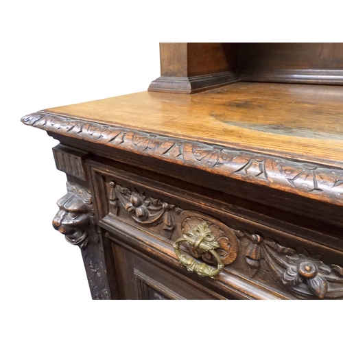 2028 - A LARGE LATE 19TH CENTURY CONTINENTAL OAK MIRROR BACK SIDEBOARDwith moulded projecting cornice on ca... 