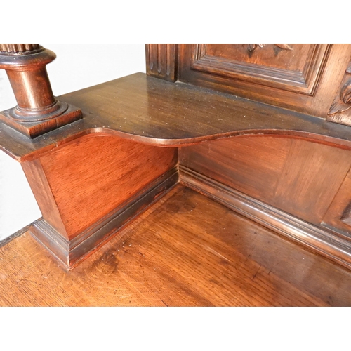 2028 - A LARGE LATE 19TH CENTURY CONTINENTAL OAK MIRROR BACK SIDEBOARDwith moulded projecting cornice on ca... 