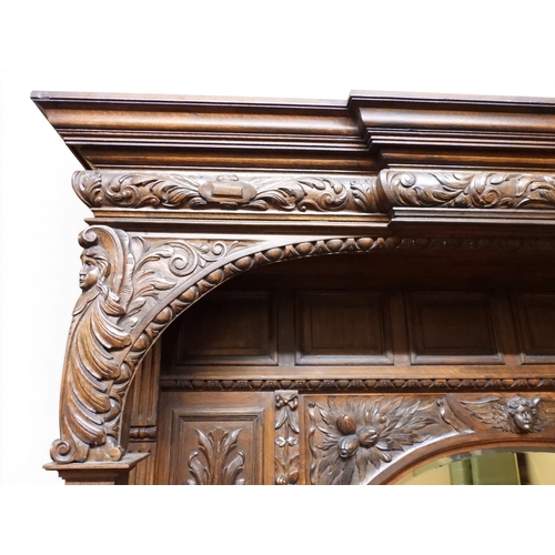 2028 - A LARGE LATE 19TH CENTURY CONTINENTAL OAK MIRROR BACK SIDEBOARDwith moulded projecting cornice on ca... 