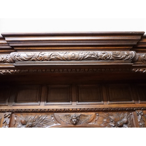 2028 - A LARGE LATE 19TH CENTURY CONTINENTAL OAK MIRROR BACK SIDEBOARDwith moulded projecting cornice on ca... 