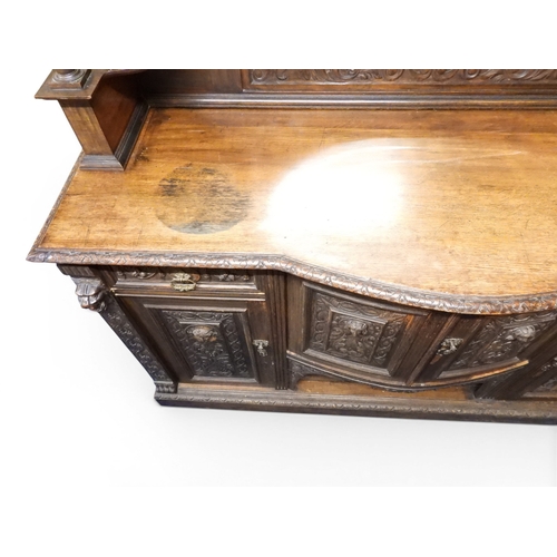 2028 - A LARGE LATE 19TH CENTURY CONTINENTAL OAK MIRROR BACK SIDEBOARDwith moulded projecting cornice on ca... 