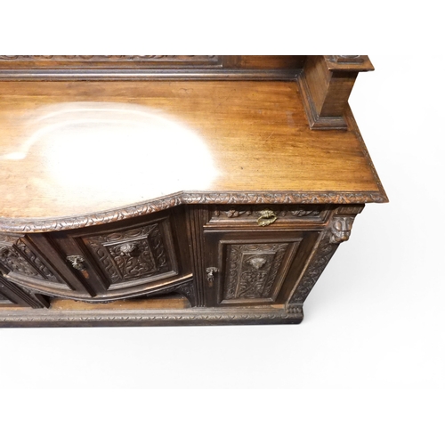 2028 - A LARGE LATE 19TH CENTURY CONTINENTAL OAK MIRROR BACK SIDEBOARDwith moulded projecting cornice on ca... 