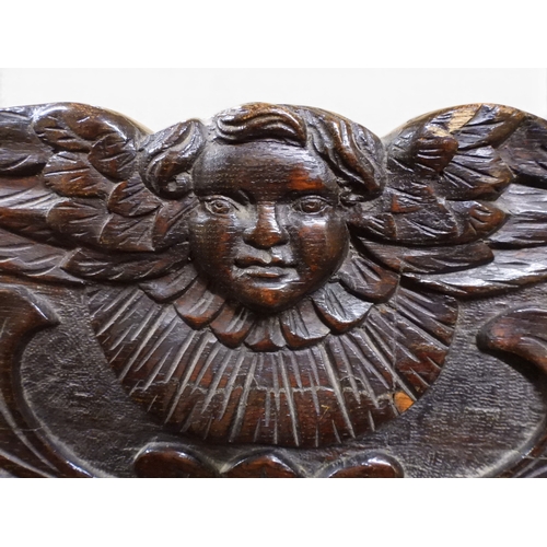 2034 - A 17TH/18TH CENTURY OAK SIX PANEL BACKED SETTLEpanelled back carved with king and men at arms surmou... 