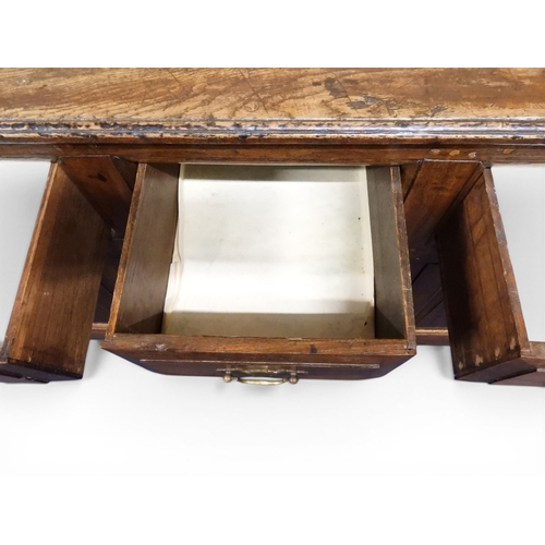 2035 - AN 18TH CENTURY OAK KITCHEN DRESSER BASEwith three plank top over three short drawers and panel cabi... 