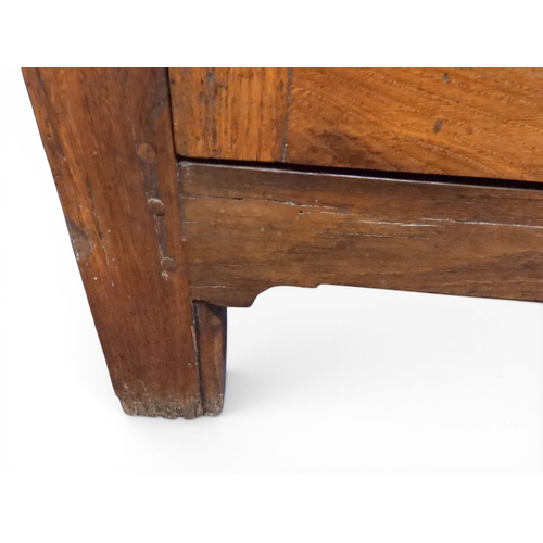 2035 - AN 18TH CENTURY OAK KITCHEN DRESSER BASEwith three plank top over three short drawers and panel cabi... 