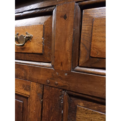 2035 - AN 18TH CENTURY OAK KITCHEN DRESSER BASEwith three plank top over three short drawers and panel cabi... 