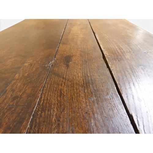 2035 - AN 18TH CENTURY OAK KITCHEN DRESSER BASEwith three plank top over three short drawers and panel cabi... 