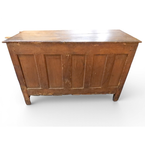 2035 - AN 18TH CENTURY OAK KITCHEN DRESSER BASEwith three plank top over three short drawers and panel cabi... 