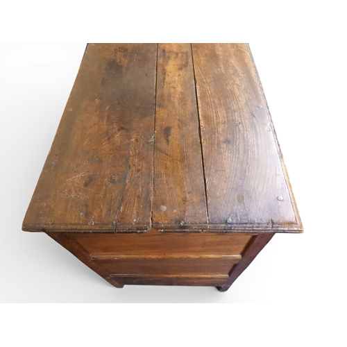2035 - AN 18TH CENTURY OAK KITCHEN DRESSER BASEwith three plank top over three short drawers and panel cabi... 