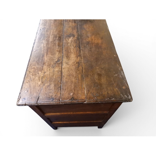 2035 - AN 18TH CENTURY OAK KITCHEN DRESSER BASEwith three plank top over three short drawers and panel cabi... 