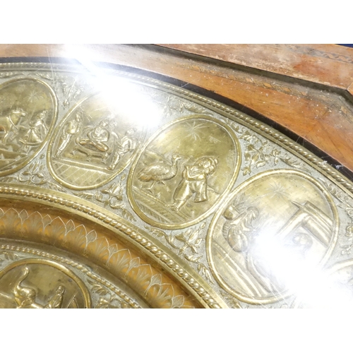 2053 - A LARGE ARABESQUE STYLE OCTAGONAL CENTRE TABLEwith central circular brass tray embossed with reclini... 