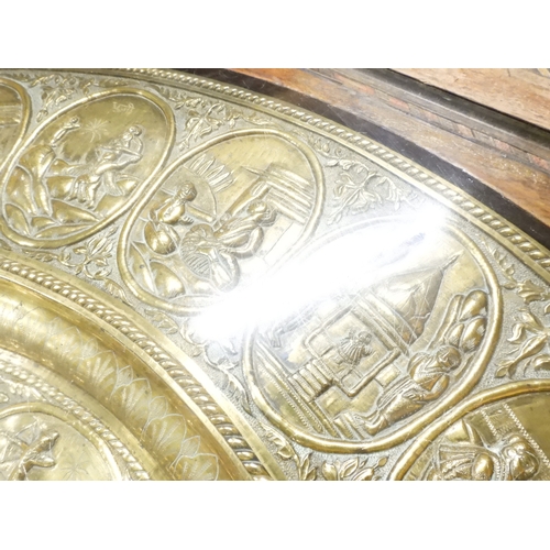 2053 - A LARGE ARABESQUE STYLE OCTAGONAL CENTRE TABLEwith central circular brass tray embossed with reclini... 