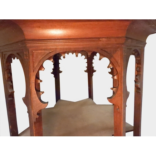 2053 - A LARGE ARABESQUE STYLE OCTAGONAL CENTRE TABLEwith central circular brass tray embossed with reclini... 